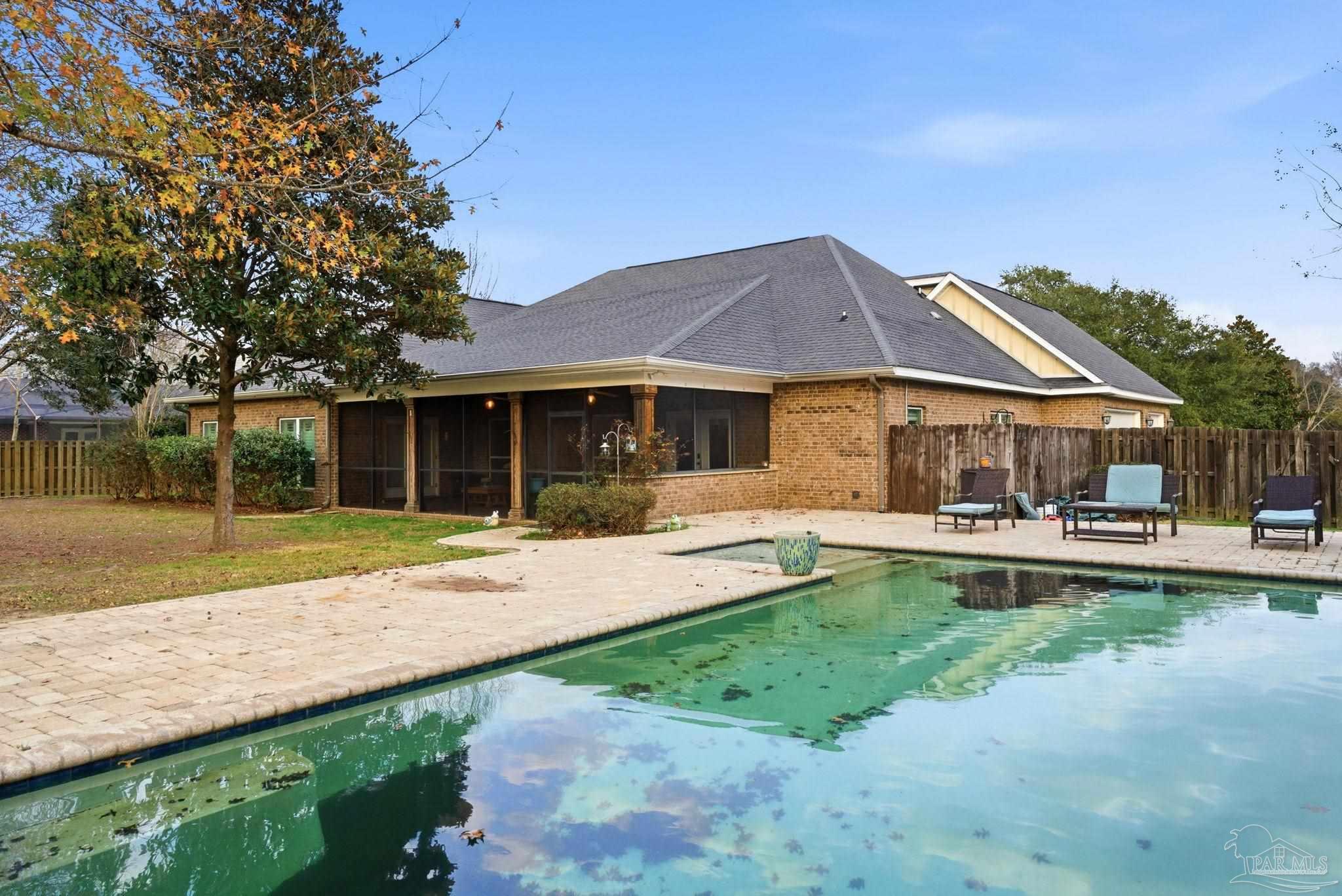 1207 Wings Way Cantonment, FL 32533 - Photo 34 of 39 a house view with swimming pool and garden space