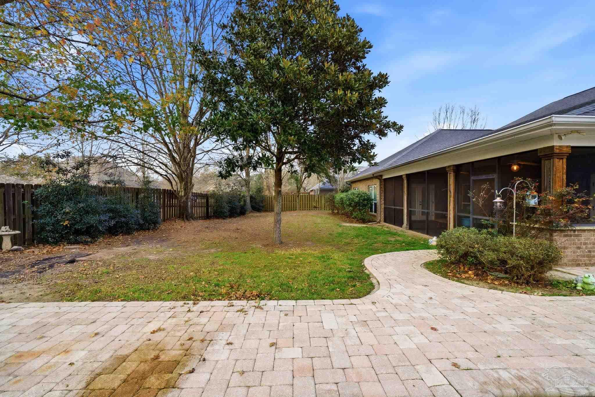1207 Wings Way Cantonment, FL 32533 - Photo 36 of 39 a view of a house with a yard