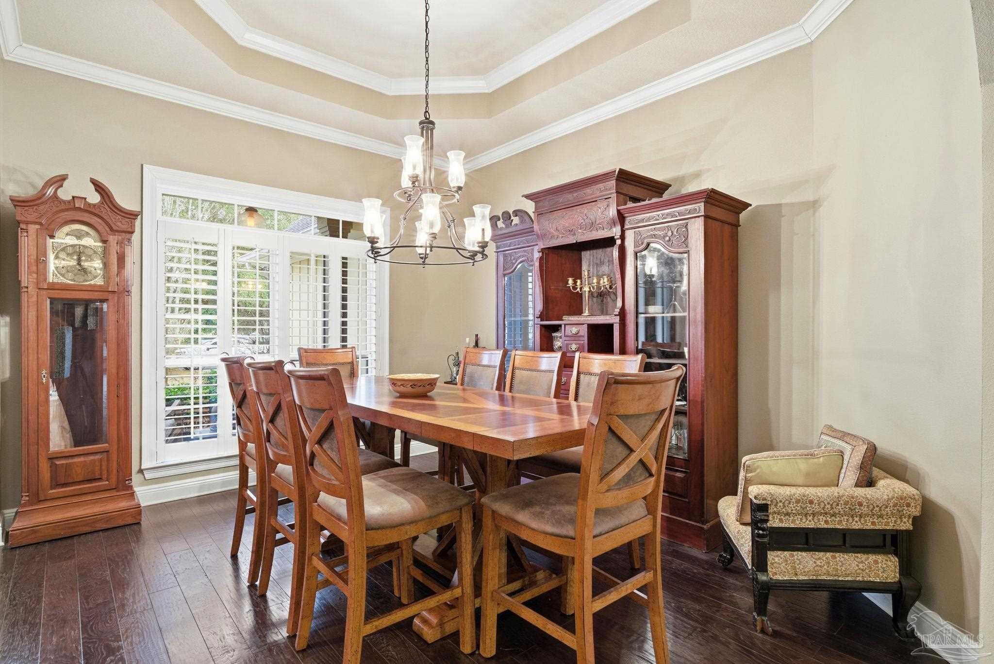 1207 Wings Way Cantonment, FL 32533 - Photo 7 of 39 a view of a dining room with furniture window and wooden floor
