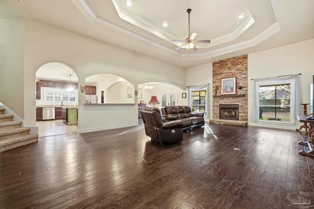 a living room with furniture and a fireplace