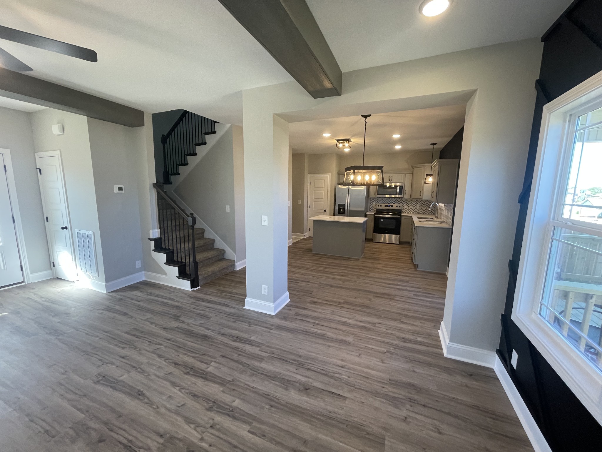 5 Hop Smith Road Cumberland Furnace, TN 37051 - Photo 13 of 23 a view of a living room with wooden floor and a fireplace