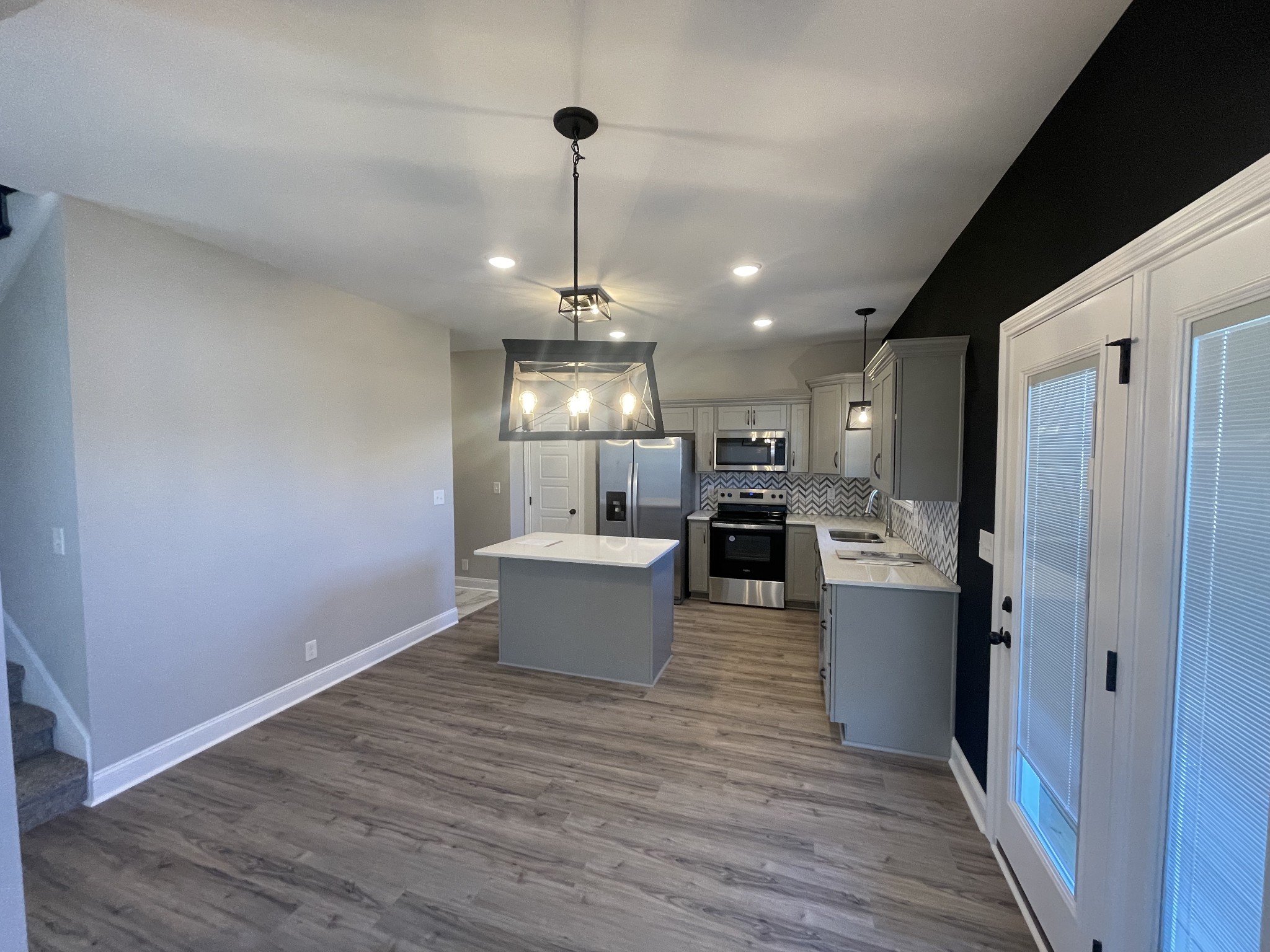 5 Hop Smith Road Cumberland Furnace, TN 37051 - Photo 14 of 23 a kitchen with stainless steel appliances kitchen island hardwood floor and a sink