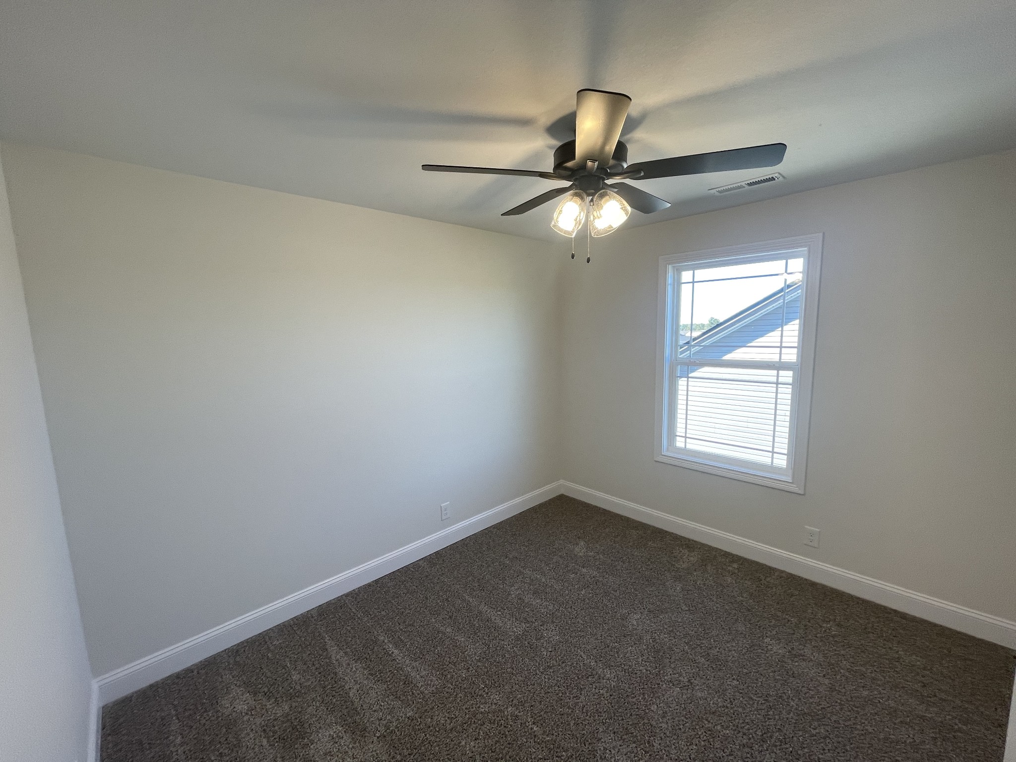 5 Hop Smith Road Cumberland Furnace, TN 37051 - Photo 8 of 23 an empty room with a window and a fan