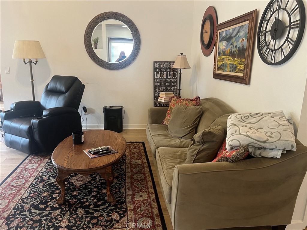 637 Torrey Pines Road Banning, CA 92220 - Photo 11 of 24 a living room with furniture and a mirror