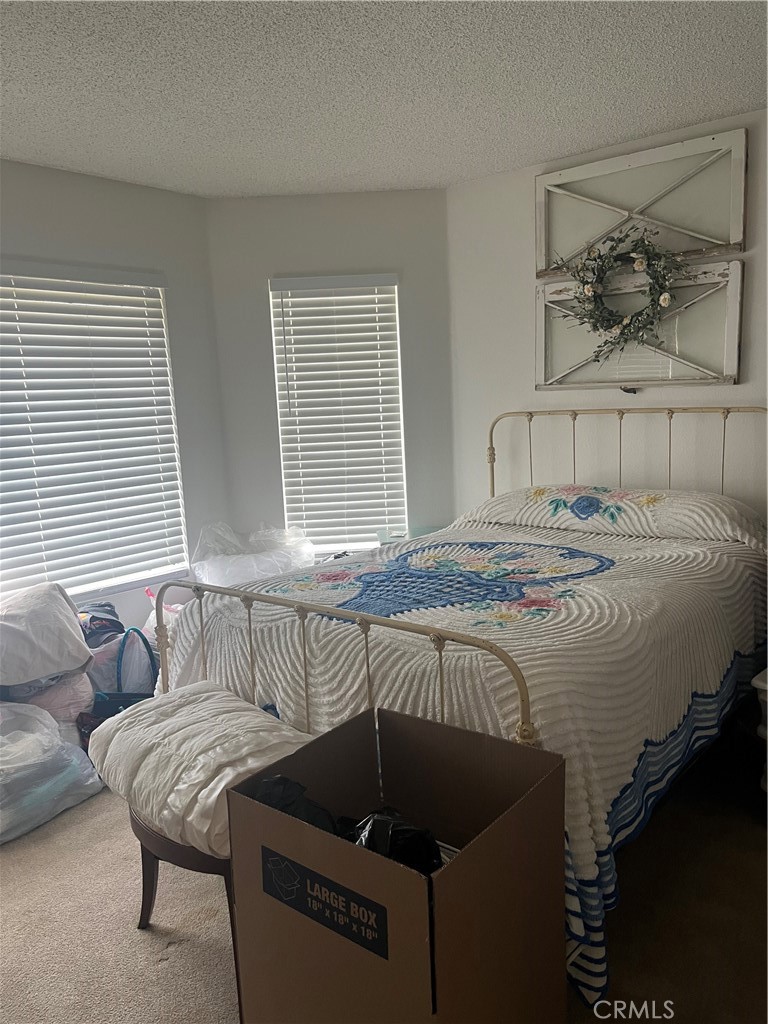 637 Torrey Pines Road Banning, CA 92220 - Photo 20 of 24 a bedroom with a bed and window