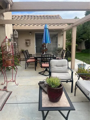 a view of living room filled with furniture and a potted plant