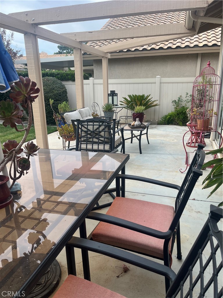 637 Torrey Pines Road Banning, CA 92220 - Photo 4 of 24 a view of a patio with table and chairs with wooden floor and plants