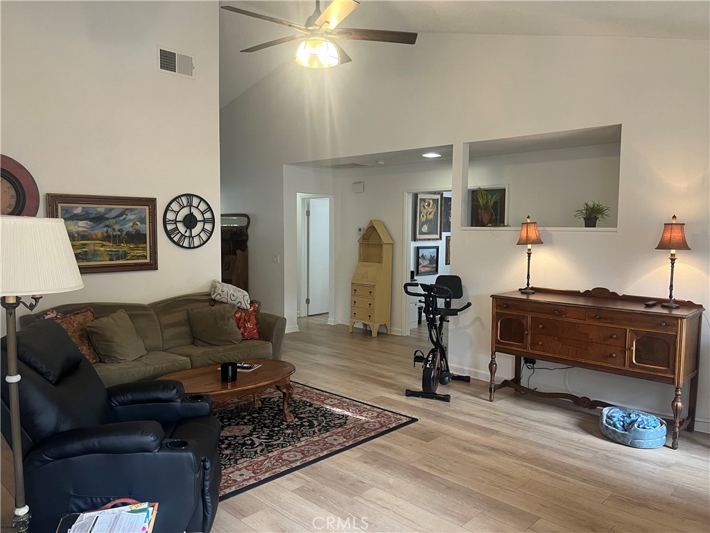637 Torrey Pines Road Banning, CA 92220 - Photo 9 of 24 a living room with furniture and a wooden floor