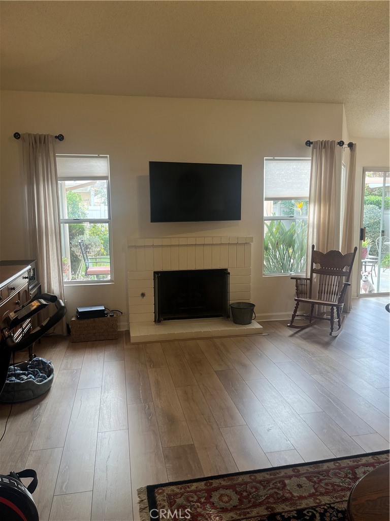 637 Torrey Pines Road Banning, CA 92220 - Photo 10 of 24 a living room with furniture and a fireplace