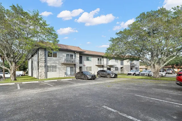 a view of a cars parked in front of a building