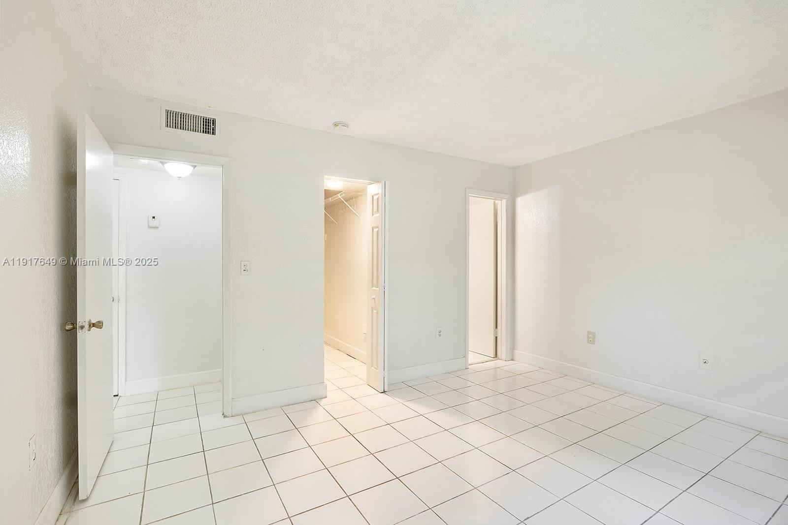 6530 Lake Patricia Drive, Unit E25 Miami Lakes, FL 33014 - Photo 5 of 16 a view of an empty room