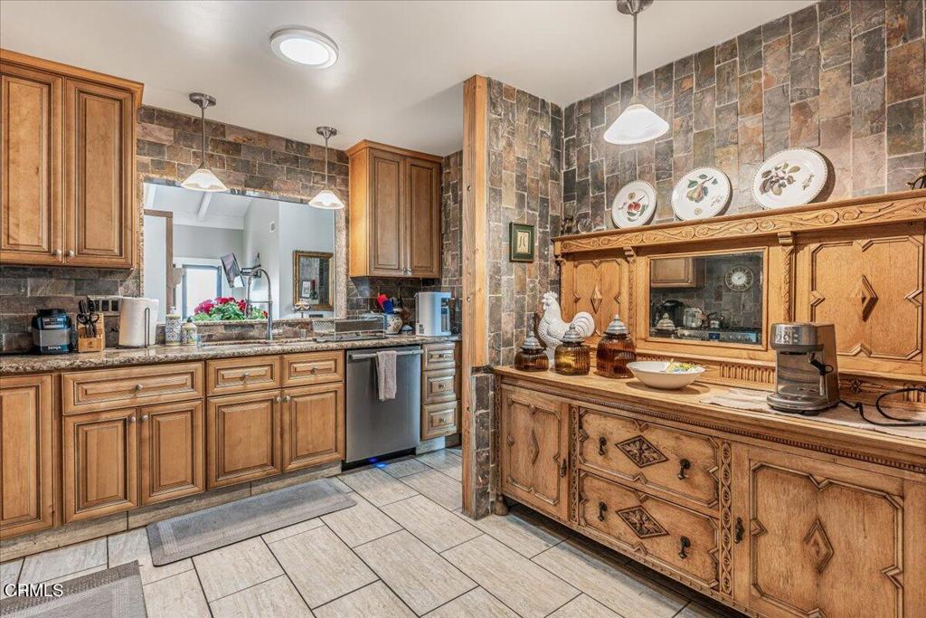 541 Broderick Way Port Hueneme, CA 93041 - Photo 17 of 35 a kitchen with stainless steel appliances granite countertop a sink and cabinets