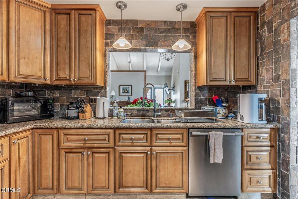 541 Broderick Way Port Hueneme, CA 93041 - Photo 18 of 35 a kitchen with granite countertop a sink and cabinets