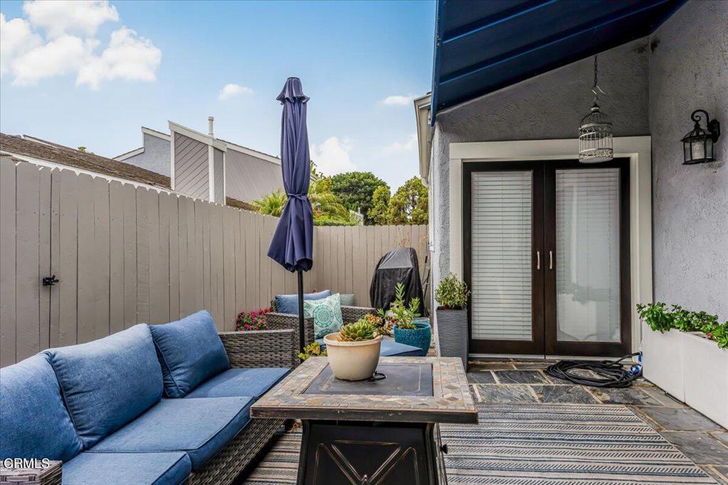 541 Broderick Way Port Hueneme, CA 93041 - Photo 28 of 35 a table and chairs in front of a door