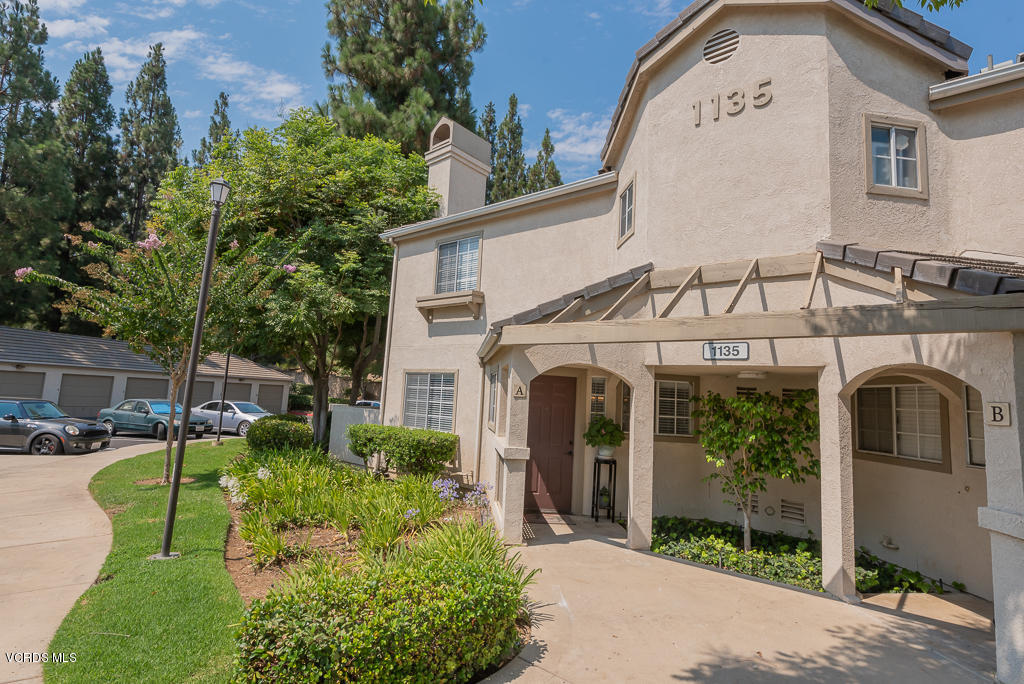 1135 Fitzgerald Road, Unit A Simi Valley, CA 93065 - Photo 2 of 49 a view of a white house with a big yard and potted plants