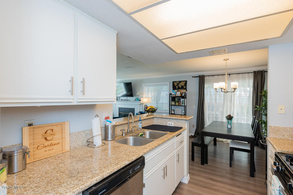 1135 Fitzgerald Road, Unit A Simi Valley, CA 93065 - Photo 14 of 49 a kitchen with granite countertop a sink a stove and cabinets