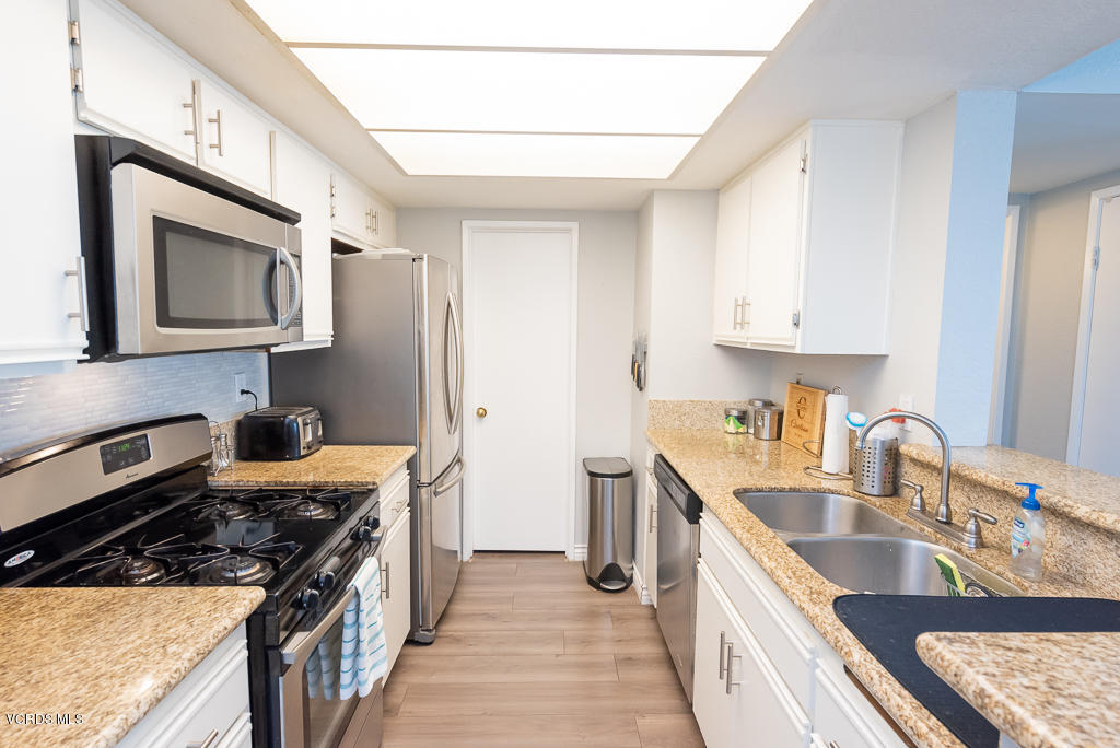 1135 Fitzgerald Road, Unit A Simi Valley, CA 93065 - Photo 17 of 49 a kitchen with stainless steel appliances granite countertop a sink stove and refrigerator