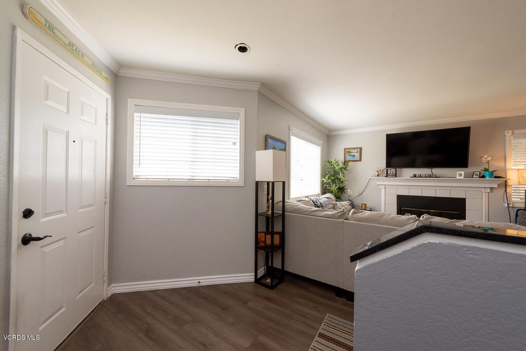 1135 Fitzgerald Road, Unit A Simi Valley, CA 93065 - Photo 21 of 49 a living room with a fireplace furniture and a flat screen tv
