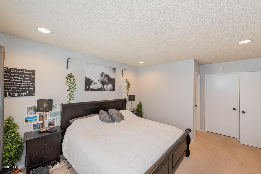 1135 Fitzgerald Road, Unit A Simi Valley, CA 93065 - Photo 25 of 49 a bedroom with a bed and a desk