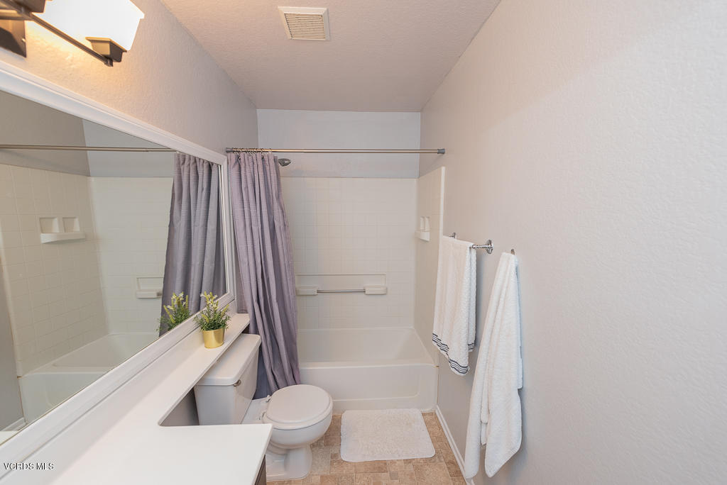 1135 Fitzgerald Road, Unit A Simi Valley, CA 93065 - Photo 29 of 49 a bathroom with a tub toilet and a shower