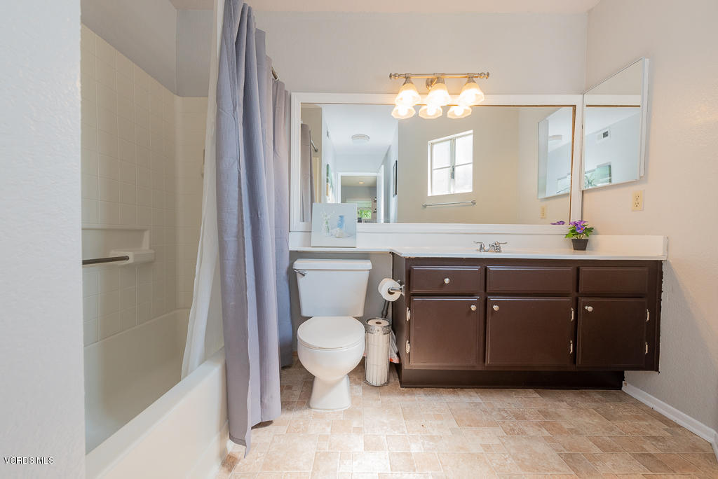 1135 Fitzgerald Road, Unit A Simi Valley, CA 93065 - Photo 35 of 49 a bathroom with a sink vanity mirror and toilet