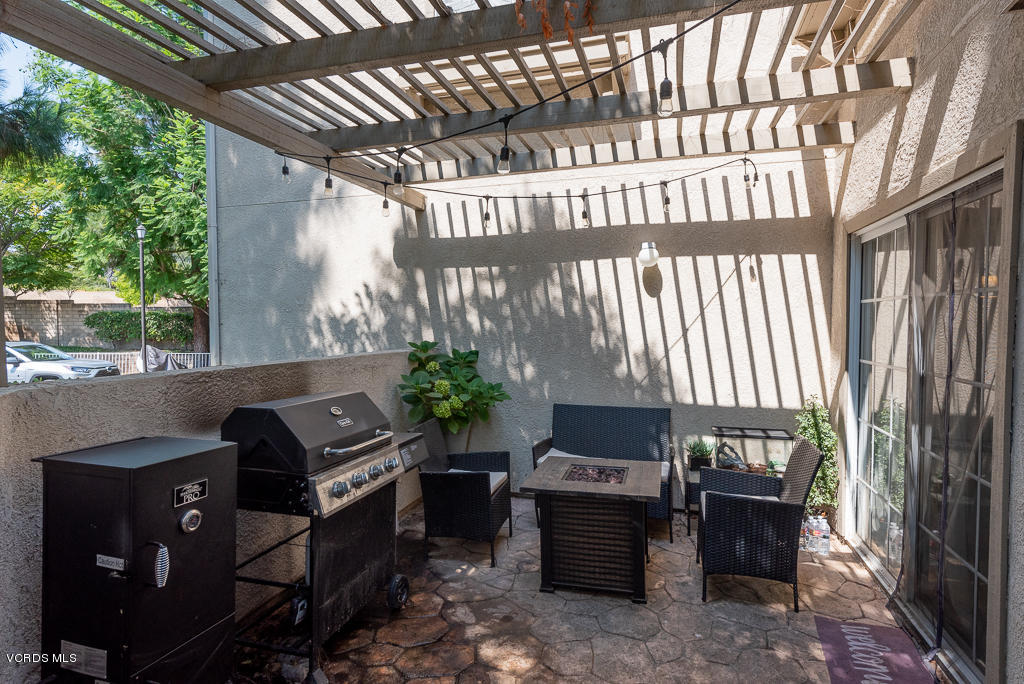 1135 Fitzgerald Road, Unit A Simi Valley, CA 93065 - Photo 38 of 49 a front view of a house with outdoor seating