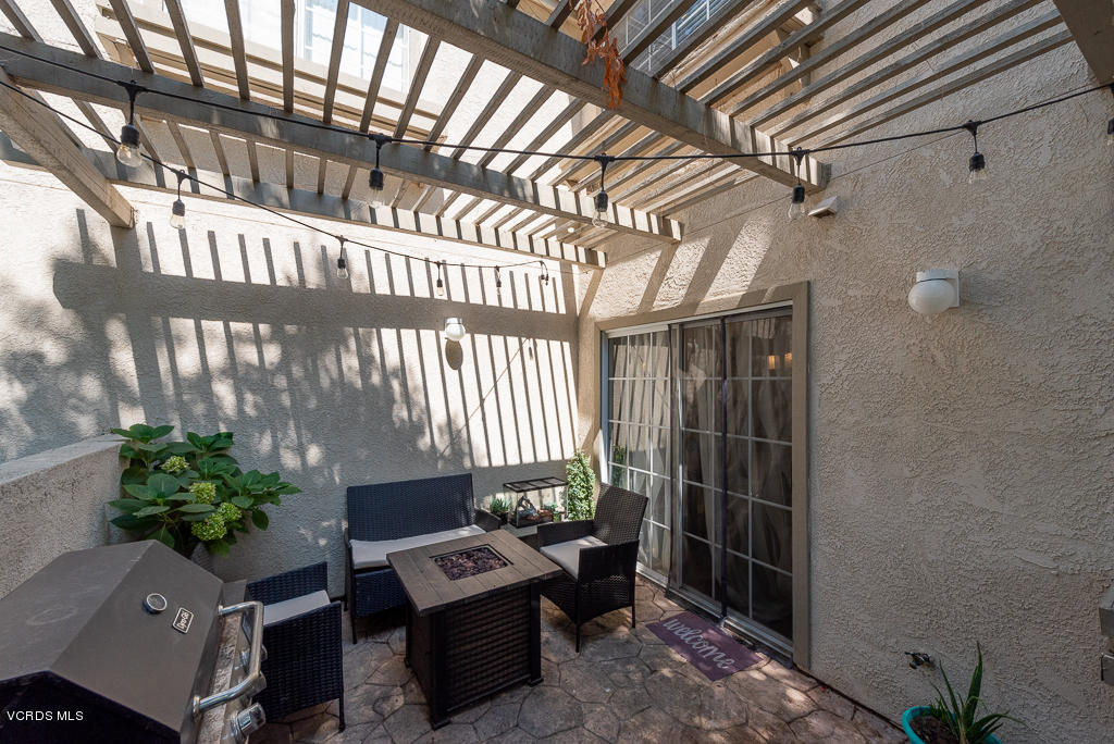 1135 Fitzgerald Road, Unit A Simi Valley, CA 93065 - Photo 39 of 49 a view of entryway with a potted plant ana a small yard