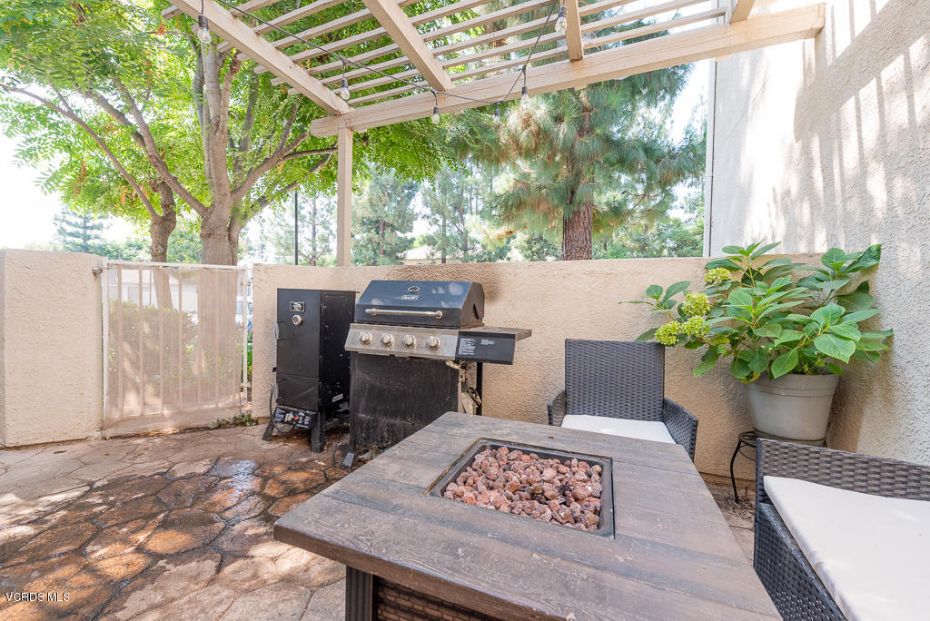 1135 Fitzgerald Road, Unit A Simi Valley, CA 93065 - Photo 41 of 49 a wooden bench sitting in front of a building