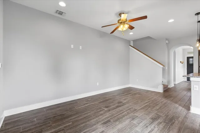 a view of kitchen with sink microwave refrigerator and cabinets