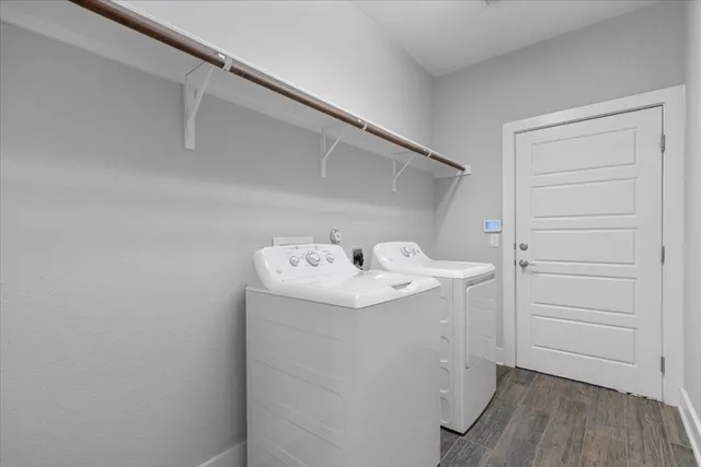 a view of an empty room with a ceiling fan