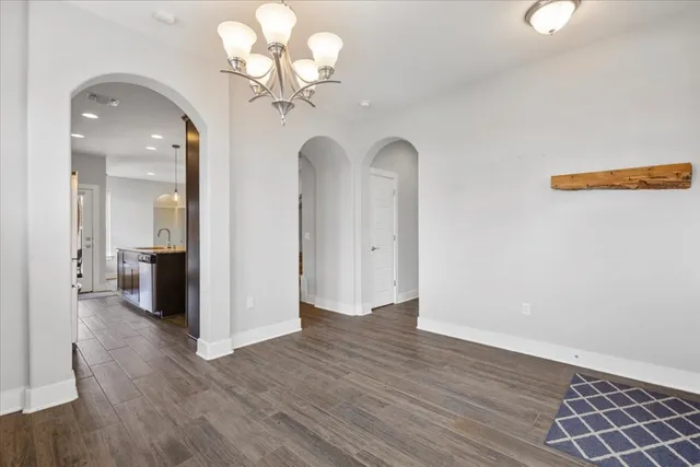 wooden floor in an empty room with a mirror