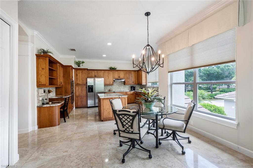 3019 Lancaster Drive, Unit 3 Naples, FL 34105 - Photo 14 of 35 a view of a dining room and furniture window and outside view