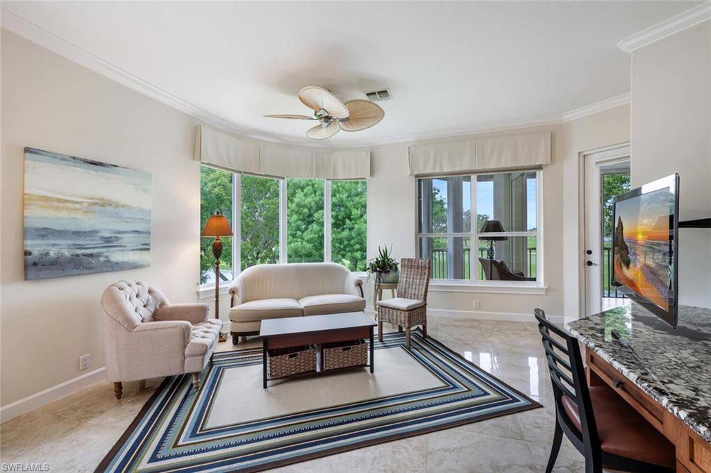 3019 Lancaster Drive, Unit 3 Naples, FL 34105 - Photo 18 of 35 a living room with furniture large window and wooden floor