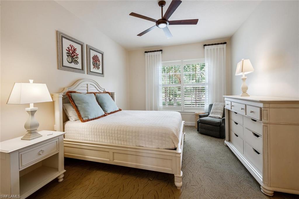 3019 Lancaster Drive, Unit 3 Naples, FL 34105 - Photo 26 of 35 a bedroom with a bed and a dresser