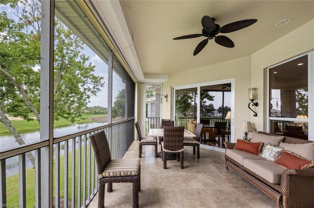 3019 Lancaster Drive, Unit 3 Naples, FL 34105 - Photo 33 of 35 a living room with furniture and a large window