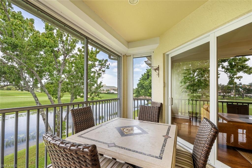 3019 Lancaster Drive, Unit 3 Naples, FL 34105 - Photo 35 of 35 a view of a patio with a table chairs and a table