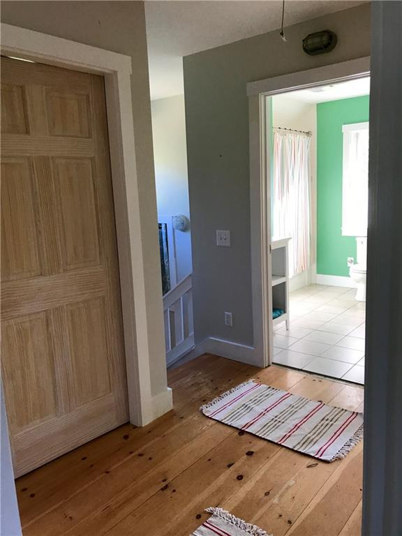 107 Boulder Hill Road Tenants Harbor, ME 04860 - Photo 10 of 18 Upstairs hallway with doors leading...