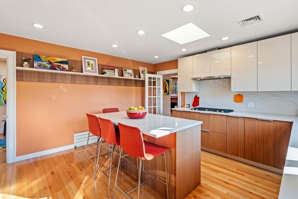 52 Sherbrooke Road Newton, MA 02458 - Photo 12 of 35 a kitchen with stainless steel appliances granite countertop a sink and a refrigerator