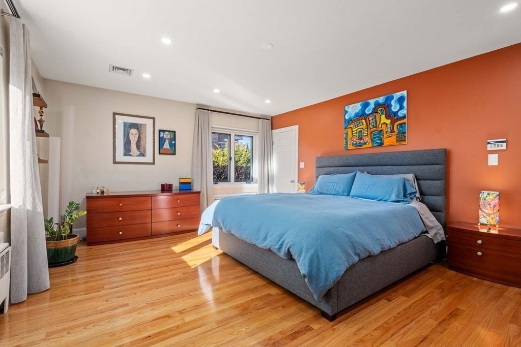 52 Sherbrooke Road Newton, MA 02458 - Photo 20 of 35 a spacious bedroom with a large bed and a large window