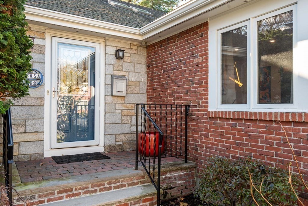 52 Sherbrooke Road Newton, MA 02458 - Photo 2 of 35 a front view of a house with a yard