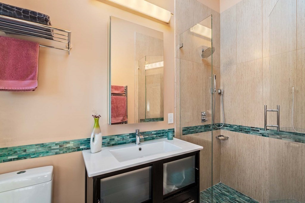 52 Sherbrooke Road Newton, MA 02458 - Photo 21 of 35 a bathroom with a sink and a mirror