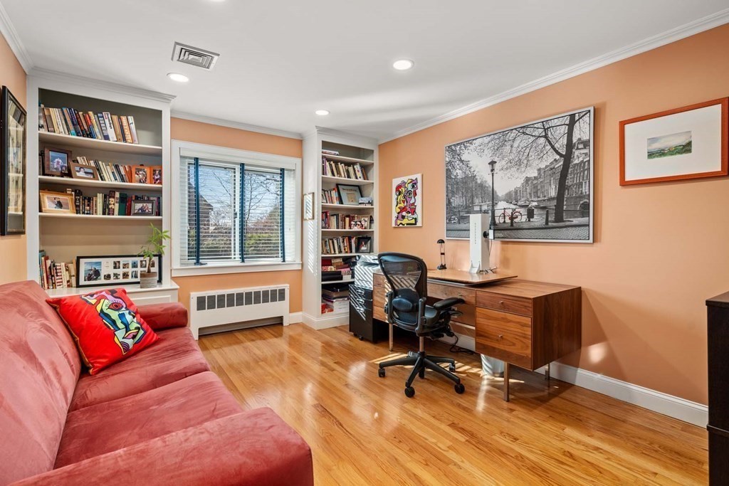 52 Sherbrooke Road Newton, MA 02458 - Photo 25 of 35 a living room with furniture and a book shelf