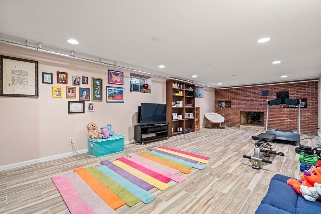 52 Sherbrooke Road Newton, MA 02458 - Photo 26 of 35 a room that has a bed and a table in it