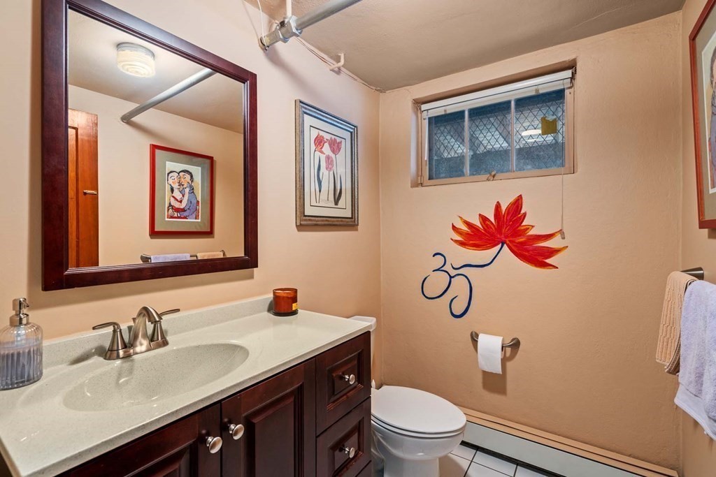 52 Sherbrooke Road Newton, MA 02458 - Photo 27 of 35 a bathroom with a sink vanity mirror and toilet