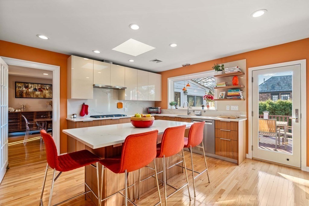 52 Sherbrooke Road Newton, MA 02458 - Photo 10 of 35 a dining hall with stainless steel appliances kitchen island granite countertop a table and chairs