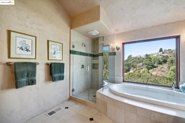 a bathroom with a bathtub and a shower