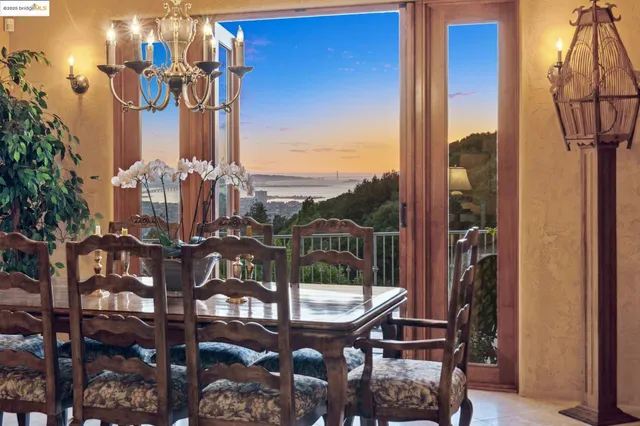 a view of a balcony with a table and chairs