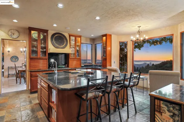 a kitchen with a table and chairs in it