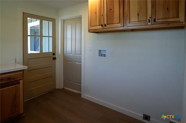 a kitchen with stainless steel appliances granite countertop a sink and a refrigerator