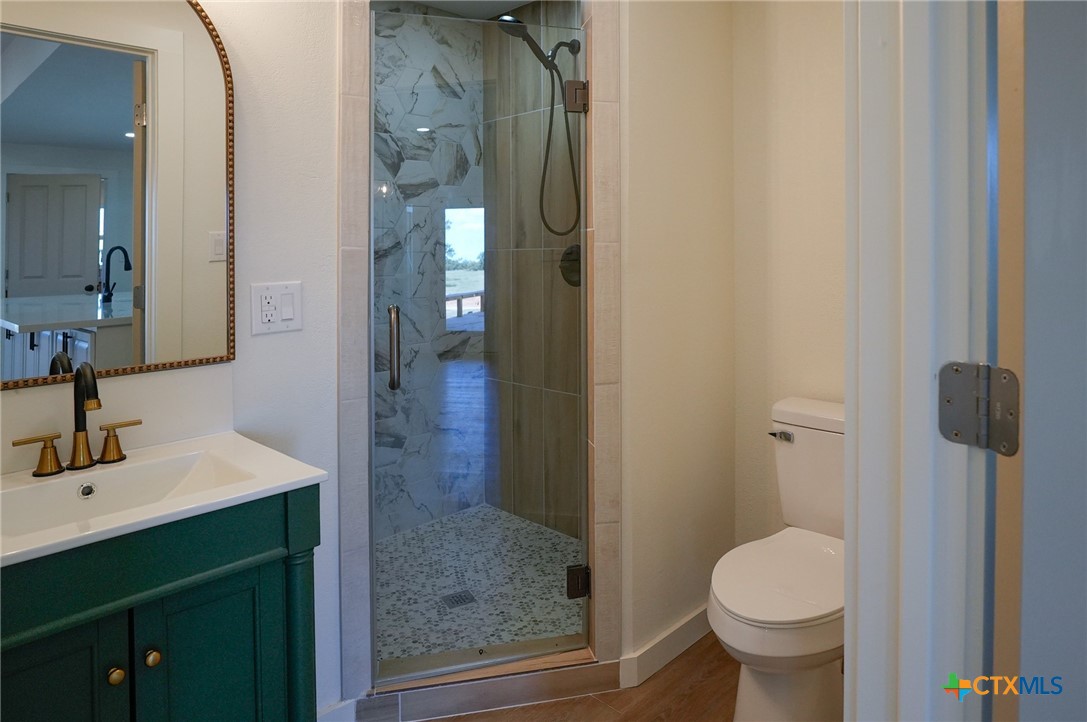 5688 Falke-Heinrich Road Schulenburg, TX 78956 - Photo 18 of 34 a bathroom with a sink toilet and shower